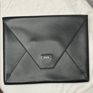 TUMI black leather envelope clutch.